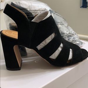 A new pair of black sandals.